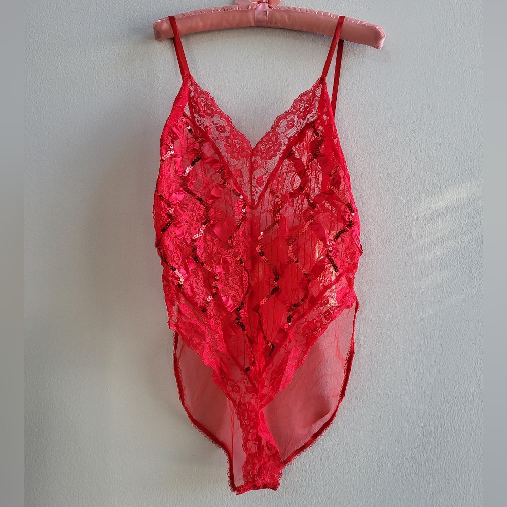 NWT with a cheeky valentines message. Red sequin bodysuit